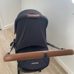 BRAND NEW Nuna Triv MagnaTech Stroller + Nuna Triv Bassinet (lightly used).